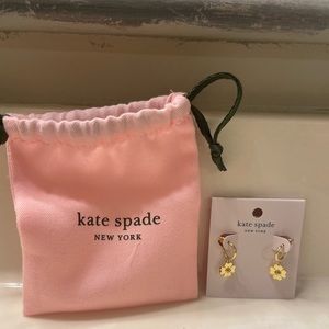 Kate Spade gold heart earrings shaped like a flower.